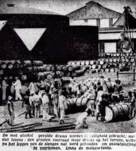 De volle drums worden in veiligheid gebracht